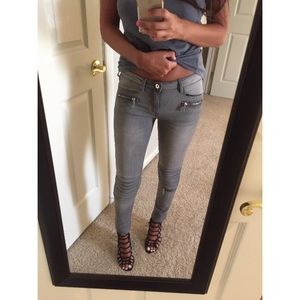 Gray jeans with detailing at the knees