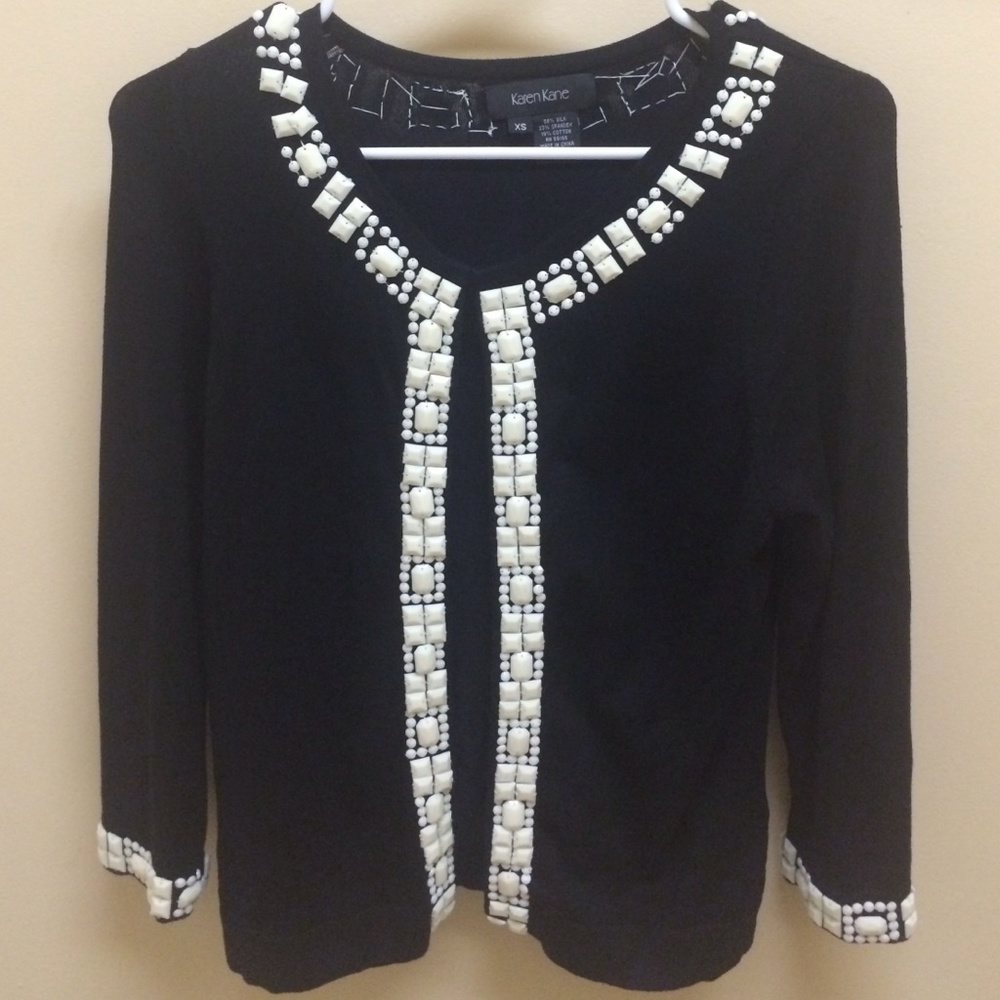 Black cardigan with white design