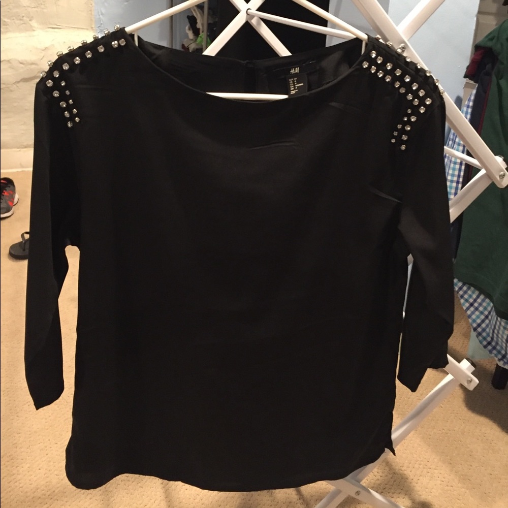 Black blouse with decorated shoulders