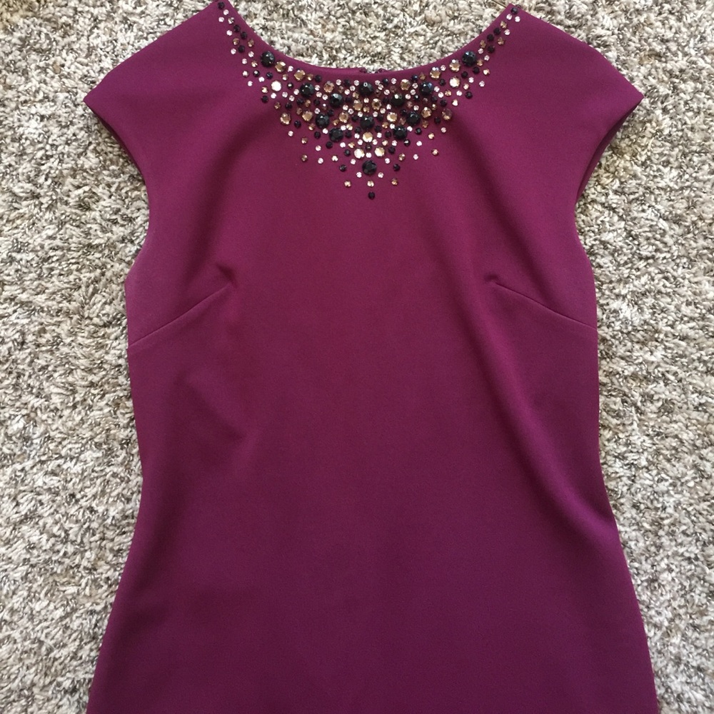 Maroon/burgundy midi with jewel accents.