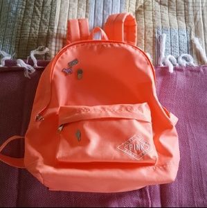 Pink mini backpack with pins