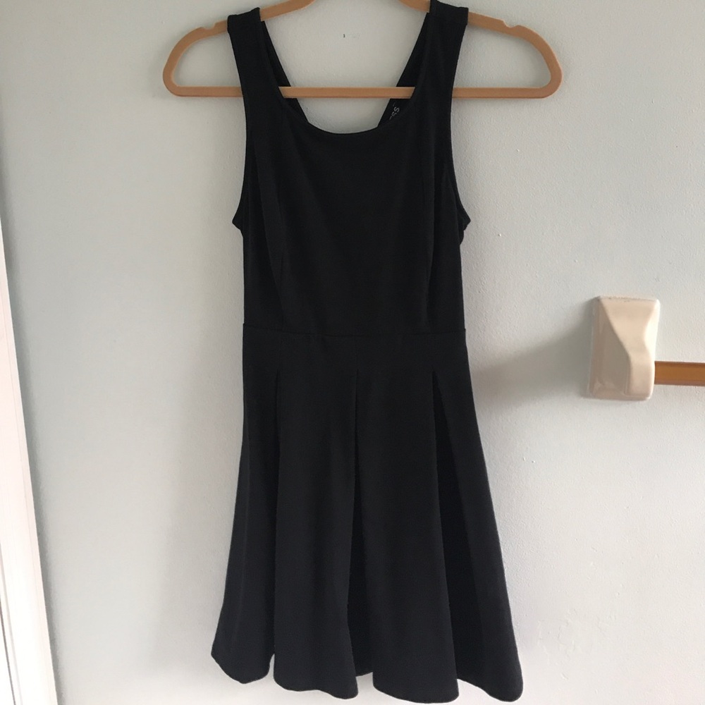 Classy black cocktail dress with an open back