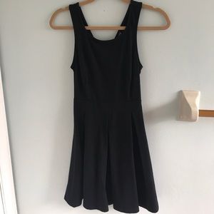 Classy black cocktail dress with an open back