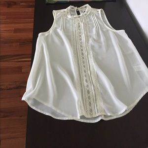 Sleeveless ivory blouse