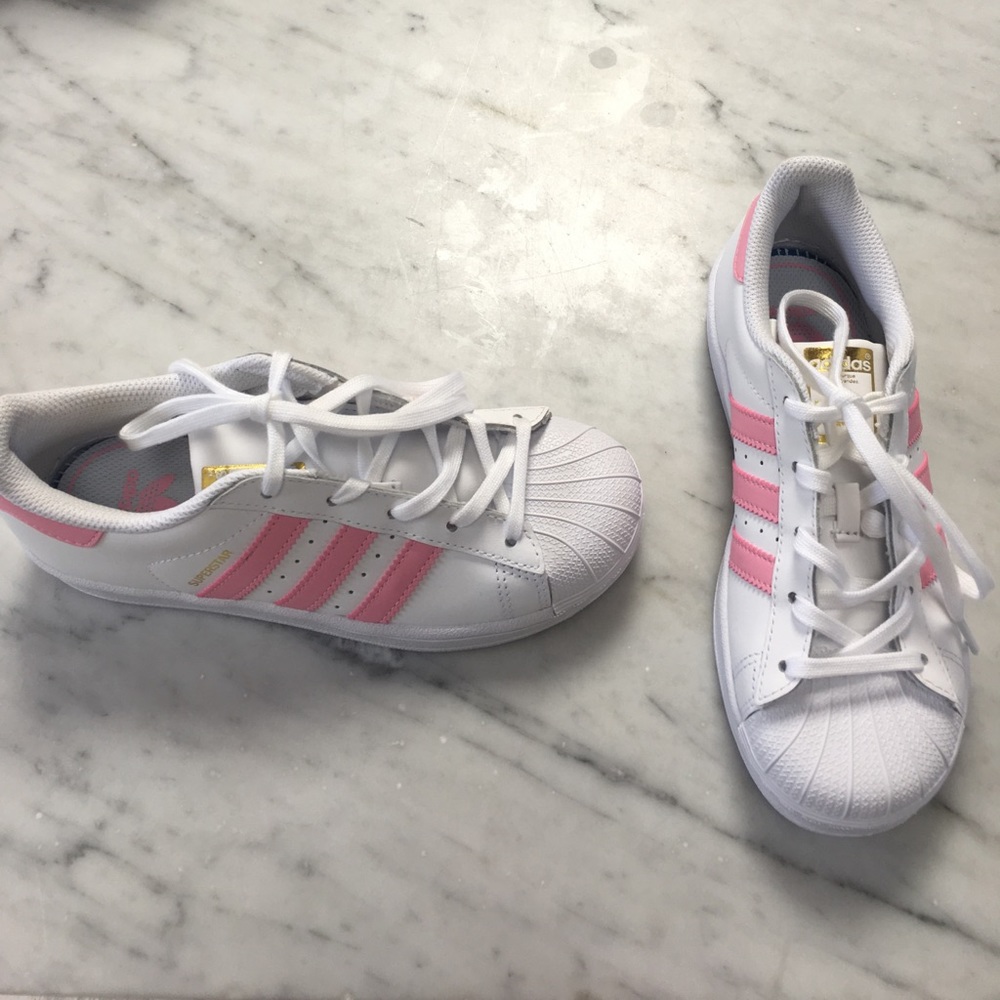 Pink striped Adidas Superstars