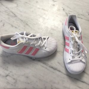 Pink striped Adidas Superstars