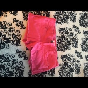 Hot pink shorts.