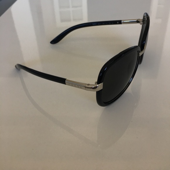 Prada sunglasses in black and silver hardware