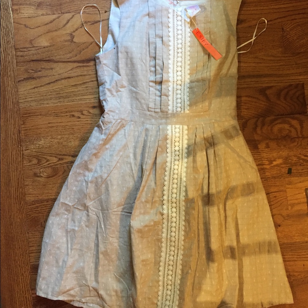 Brand new lace front pleated dress. Size medium. C