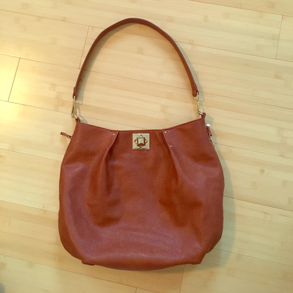 Brown leather bag with gold details