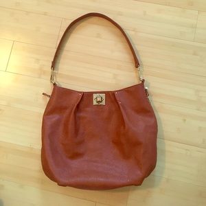 Brown leather bag with gold details