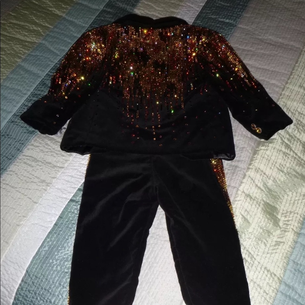 Sondra celli black and gold baby suit