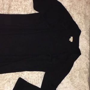 Black sweater. Up to waist.