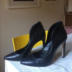 Black leather BCBG zippered stilettos