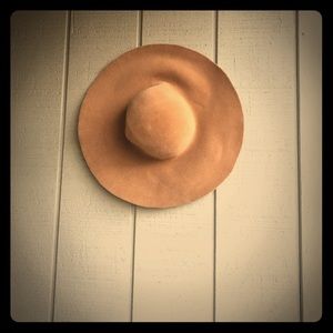 Beige felt hat .