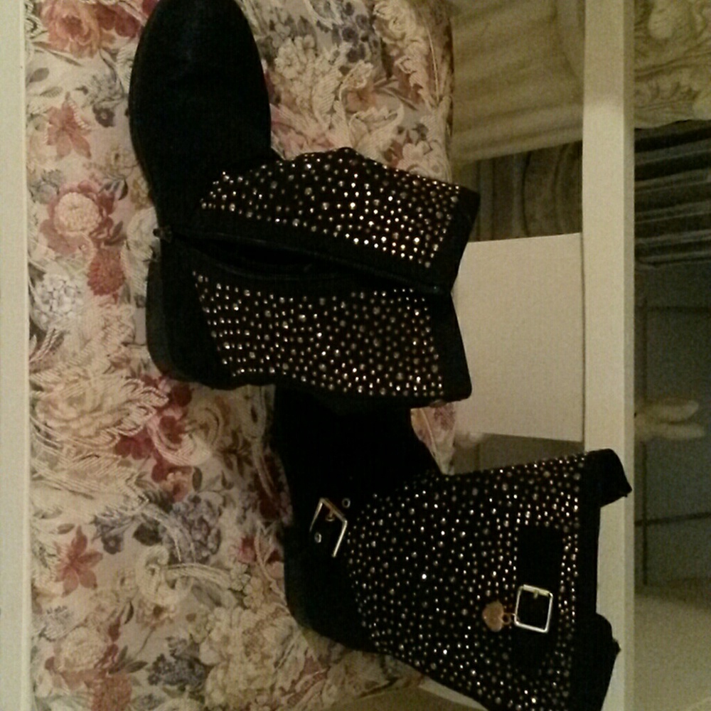 Black boots with gold studs and buckles