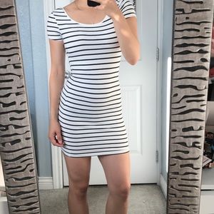 White tight-fitted dress with black stripes