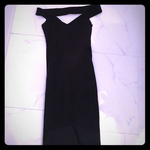 Off the shoulder form fitting black dress