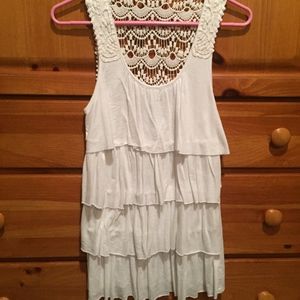 Cream ruffled front tank top with lace back detail