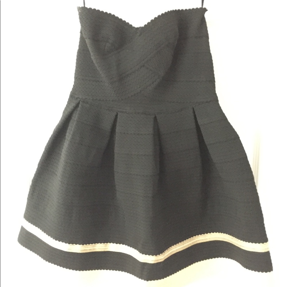 Short black strapless dress with a gold stripe