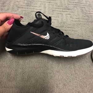 Black and rose gold Nike frees