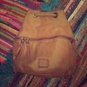 The sak tan leather back pack