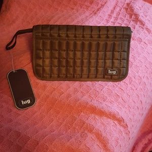 Lug travel wallet chocolate in color.