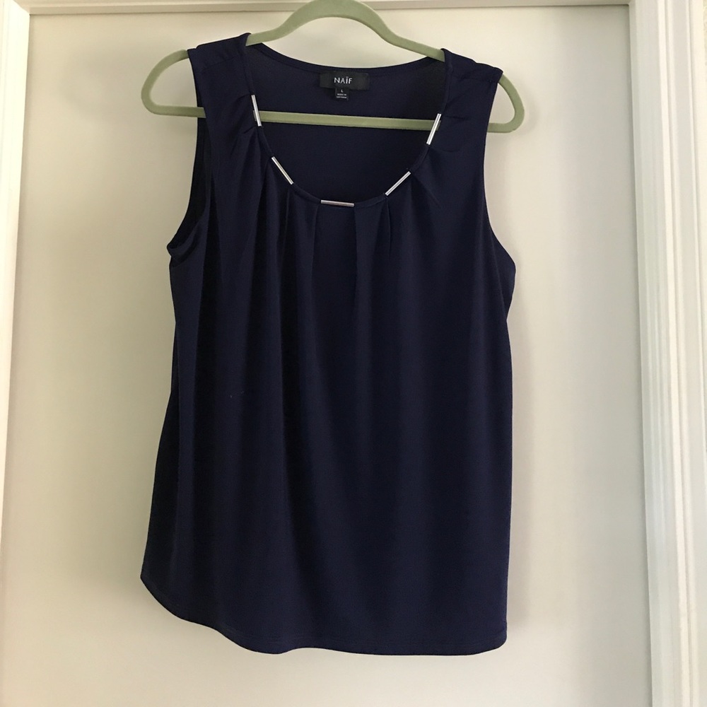 Navy blue sleeveless blouse w/ silver design.