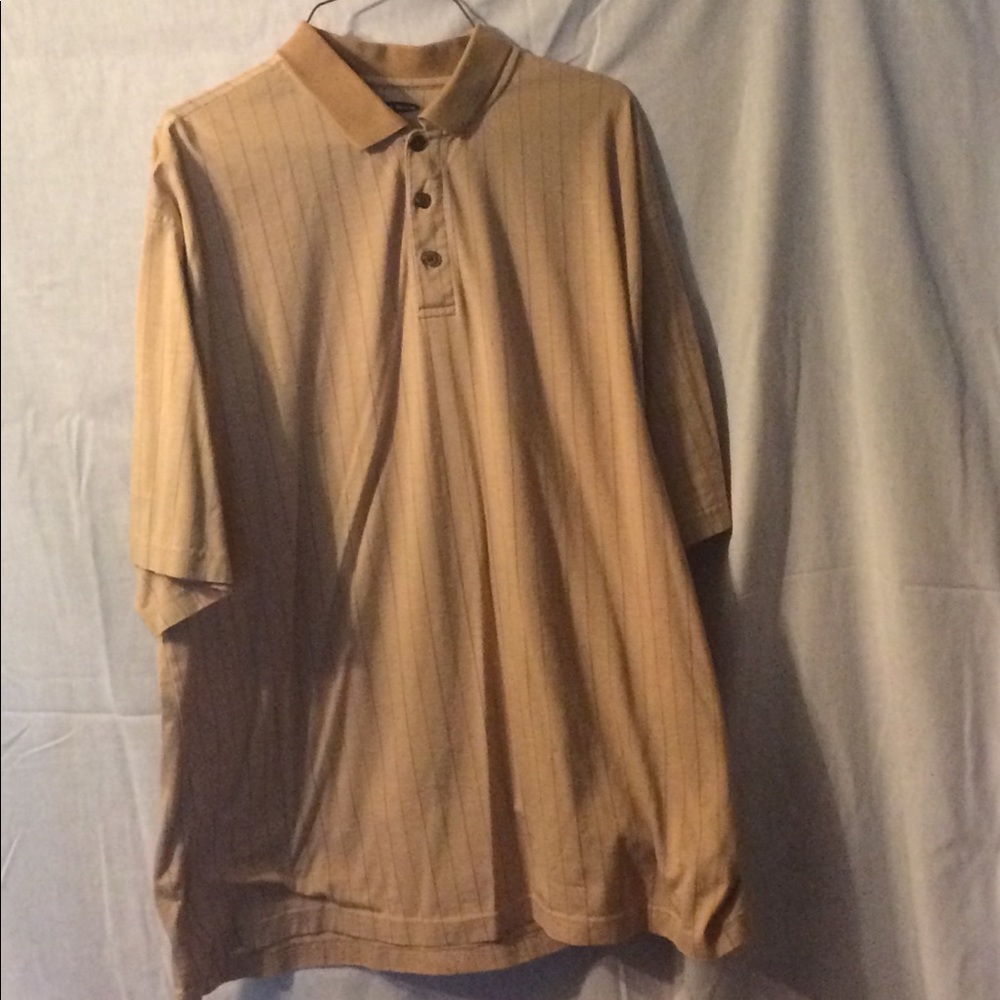 Pebble Beach. Tan shirt.