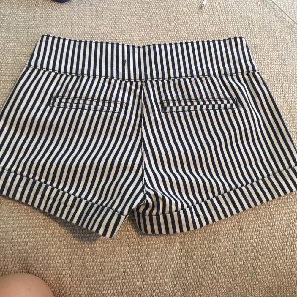 Rarely worn. Size 26. Navy blue striped shorts.