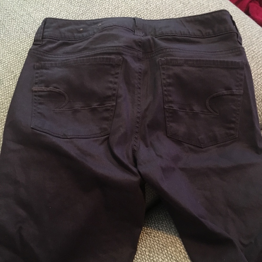Purple American eagle skinny jeans.