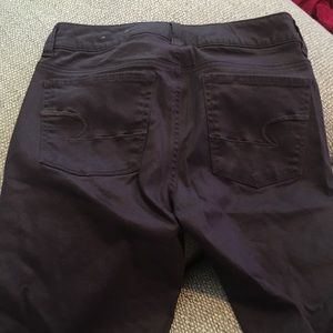 Purple American eagle skinny jeans.