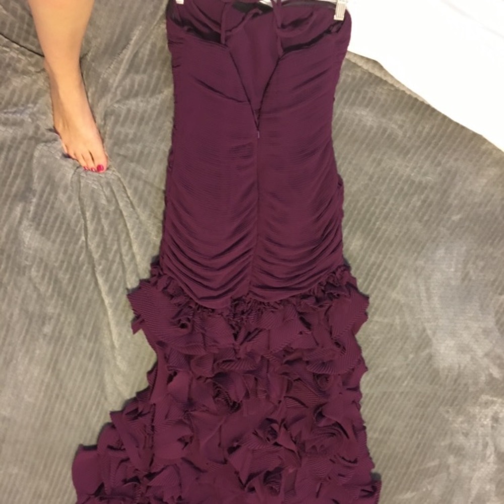 Long burgundy fancy dress. With ruffles.