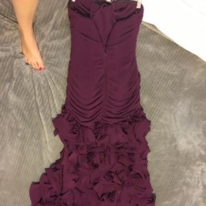 Long burgundy fancy dress. With ruffles.