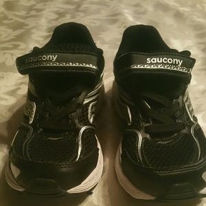 A pair of toddler boy Saucony tennis shoes