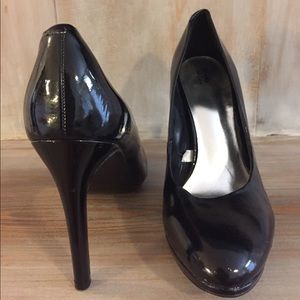 Black patten leather pumps