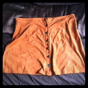Tan suede a-line skirt.