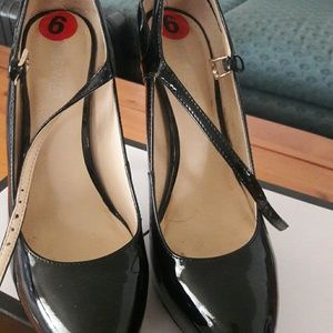 Black patent leather 4" heels.