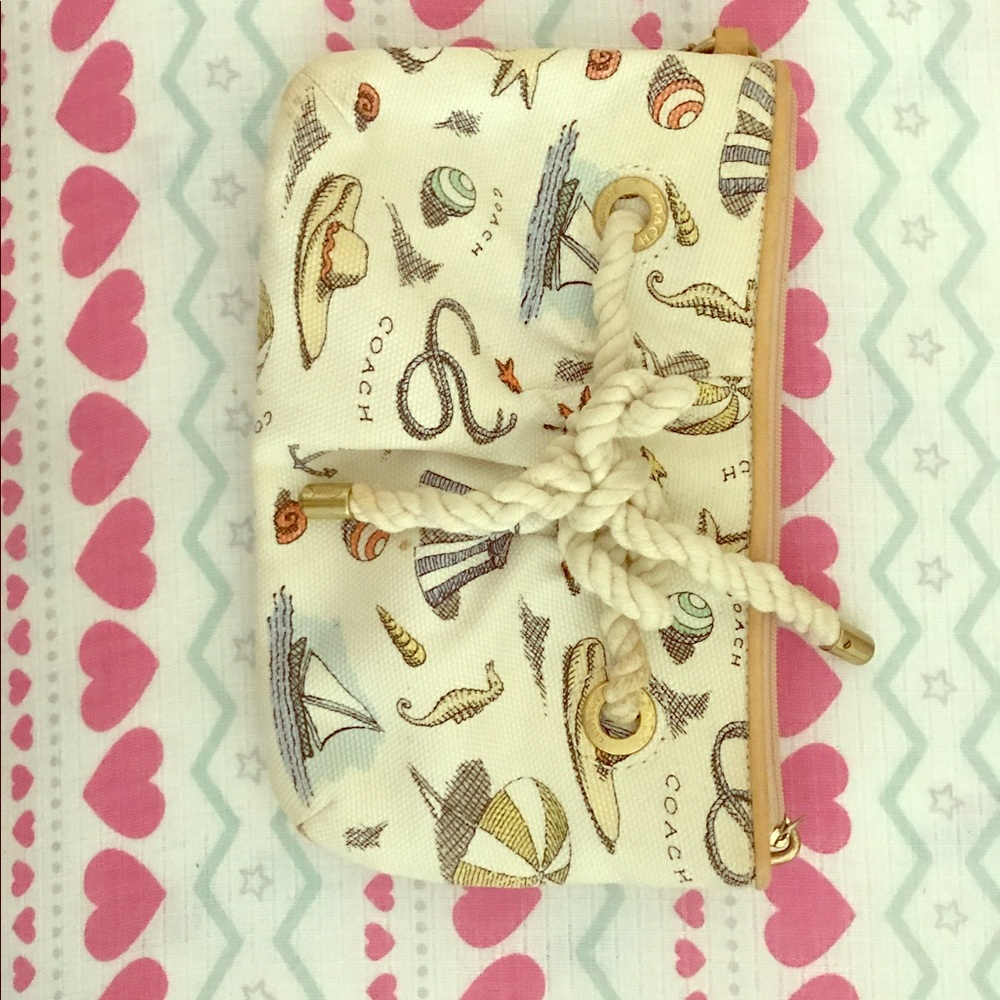 Cute beach themed coach wristlet.