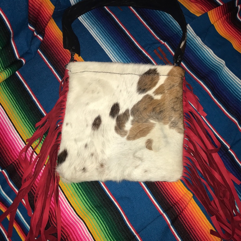 Cowhide purse with red fringe