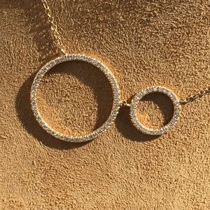 .33CT DIAMOND 14KT YELLOW GOLD CIRCLE LOVE PENDANT