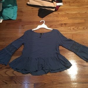 Blue peplum shirt with lace