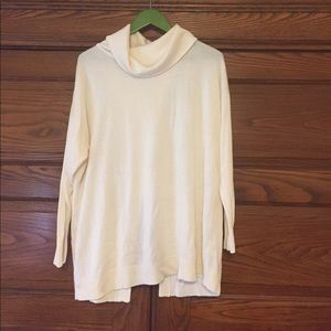 Cream cowl neck sweater with a flyaway back