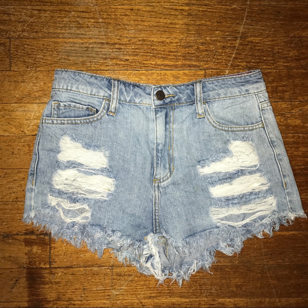 Ripped denim cutoff shorts