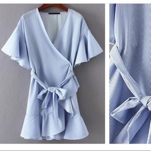 Wrap blue dress with ruffle