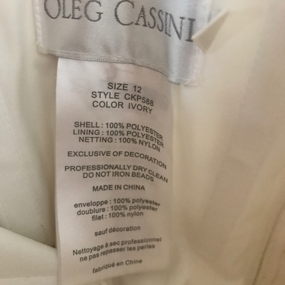 Oleg Cassini Lace Peek-a-Boo Back Wedding Dress - Picture 8 of 9