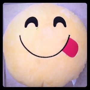 Tongue emoji pillow.