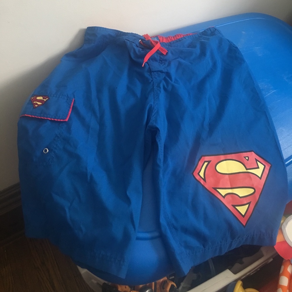 Men's superman trunks it has a small hole.