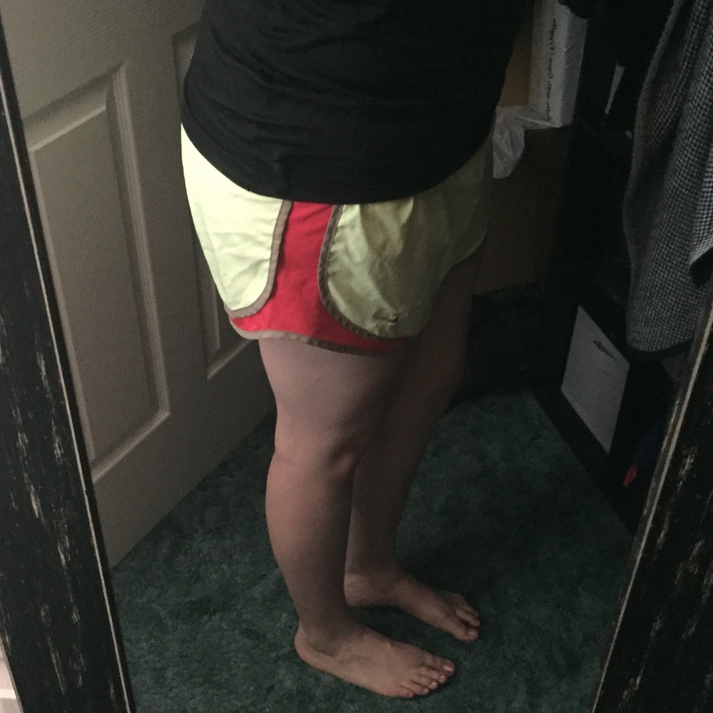 Bright yellow Nike running shorts