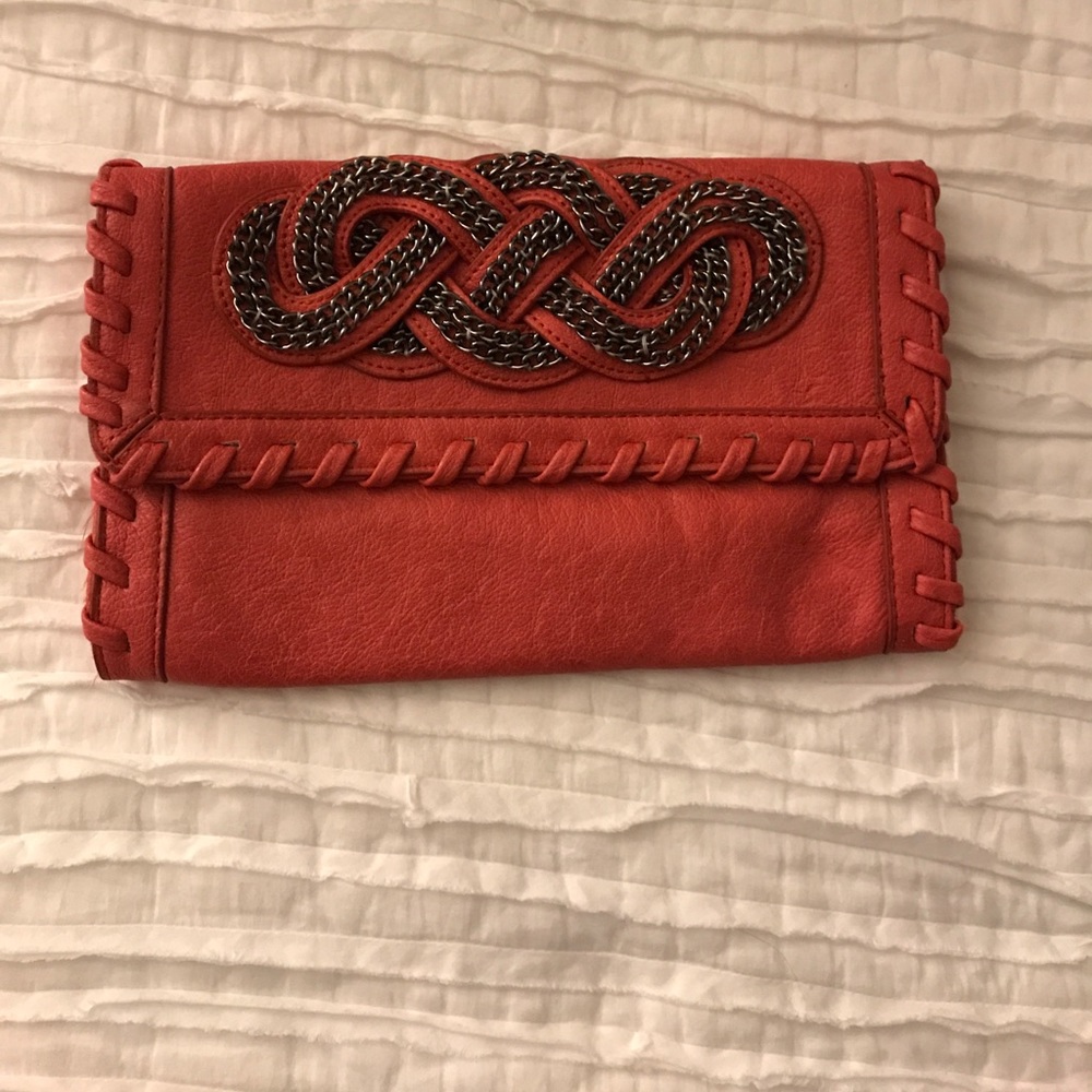 Red clutch with shoulder strap